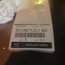 Genuine Mazda Sensor B0J8-67-UC1-6D. Fixed Price $19.99.