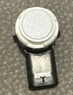 Tesla 1127503-11-D White Bumper Cover Parking Sensor Oem New With Rubber Ring. Fixed Price $18.99.